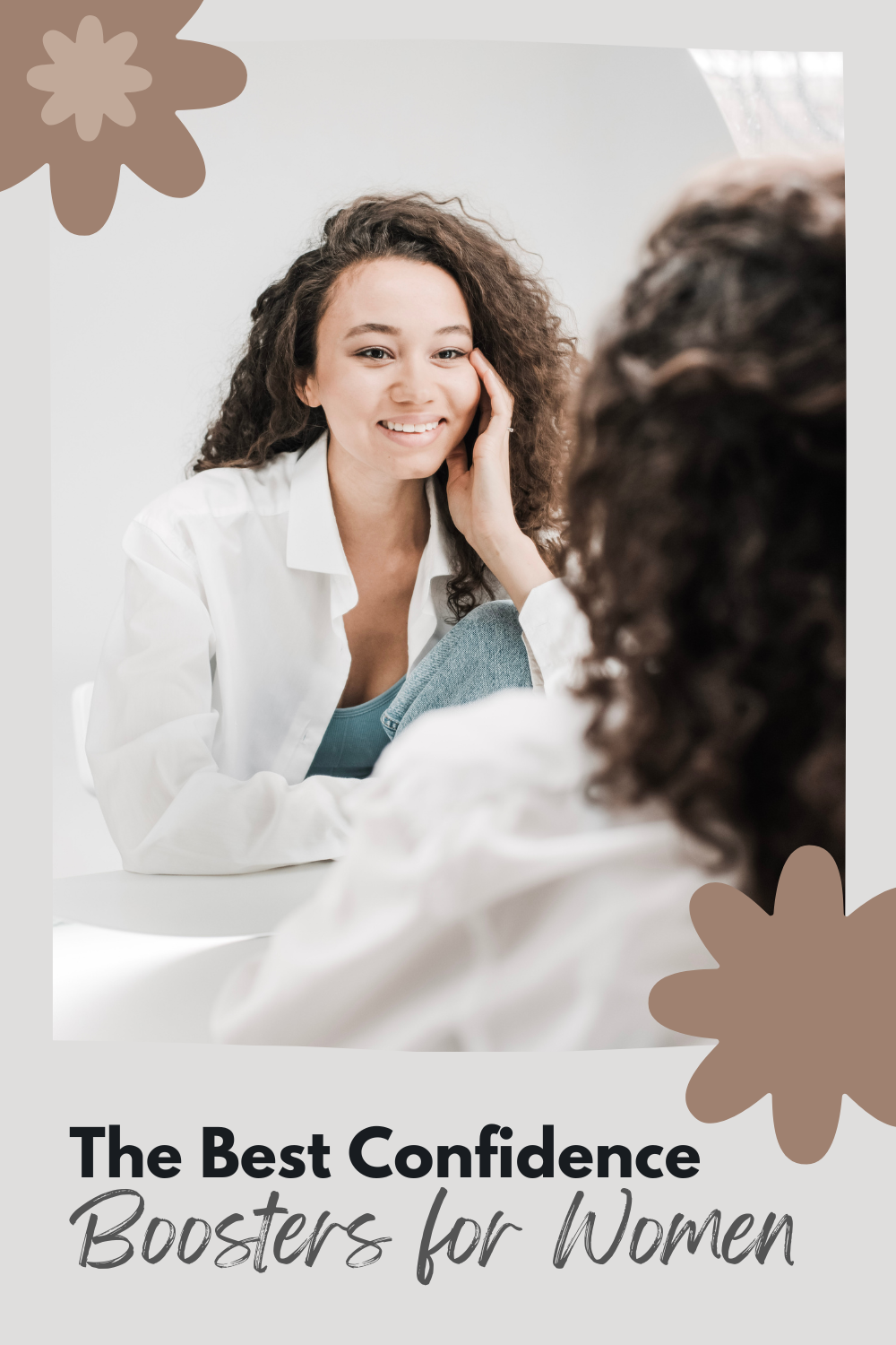 A beautiful curly-haired woman looks in the mirror at her reflection and smiles. This article covers the best confidence boosters for women.