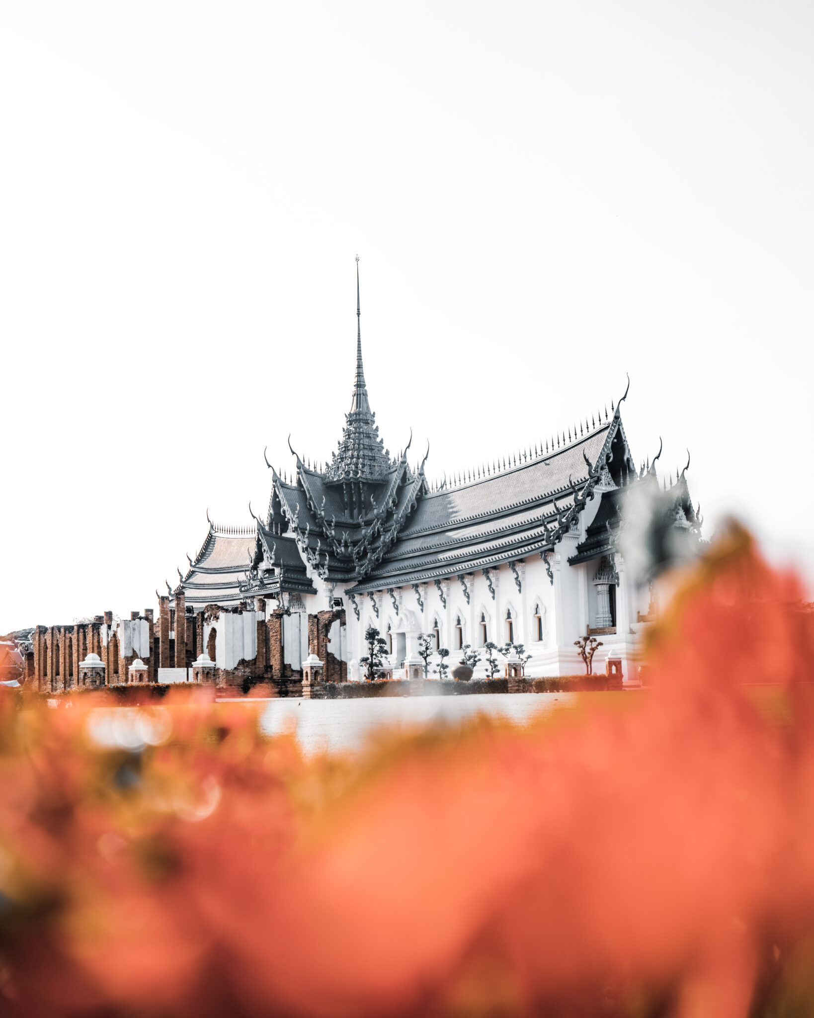 A beautiful temple in Bangkok is enhanced by fall leaves surrounding it. This article covers how to make your dream of living in another country easier.