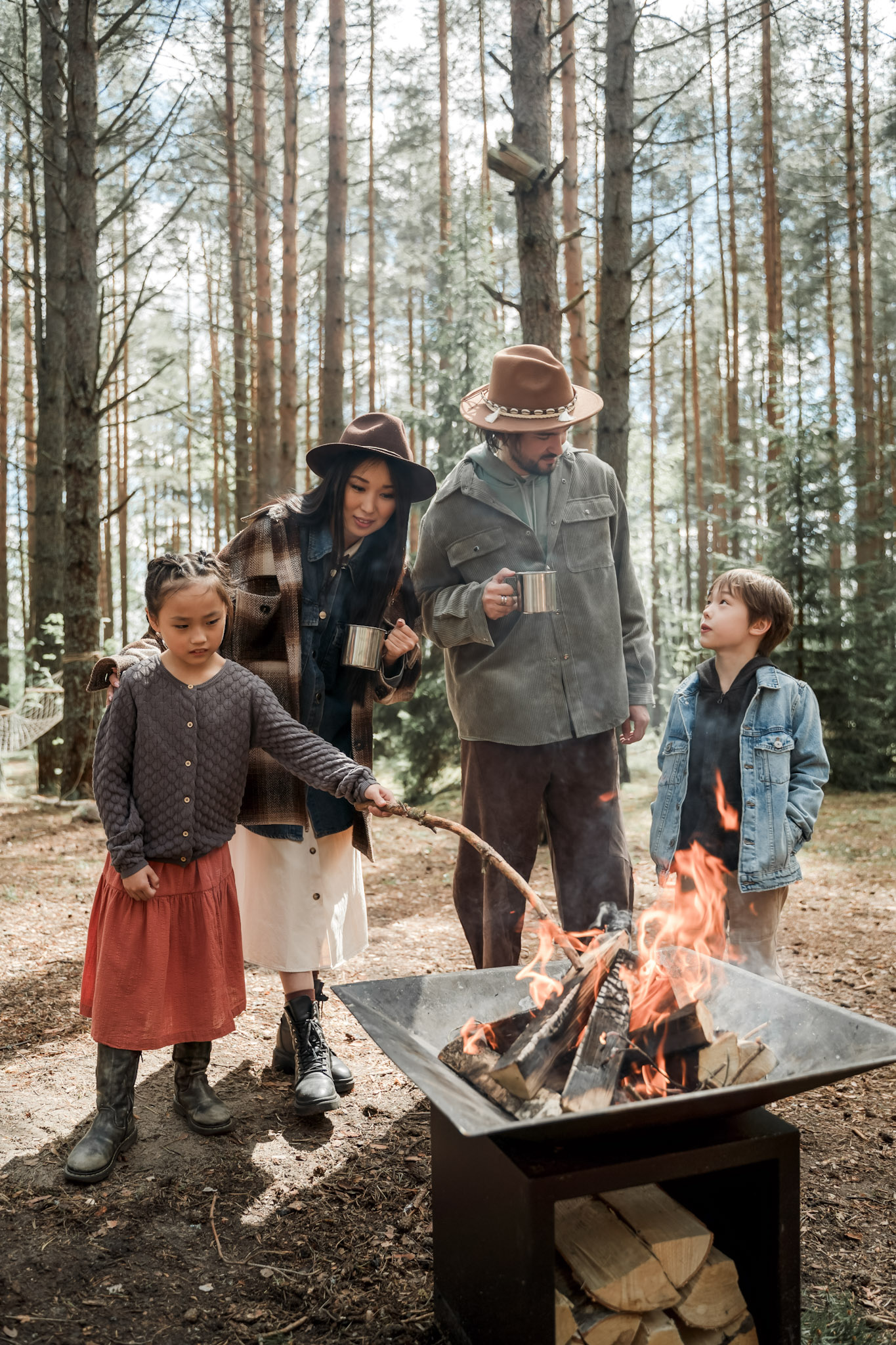 A family is enjoying a camping trip. This article provides 11 fun activities to enjoy your next fall family trip to its fullest.