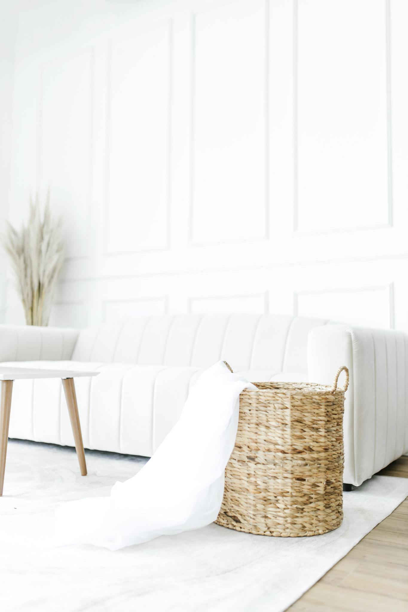 White, neutral, furniture is shown in a bright living room. This article covers creating the ideal relaxed living space with casual furniture.