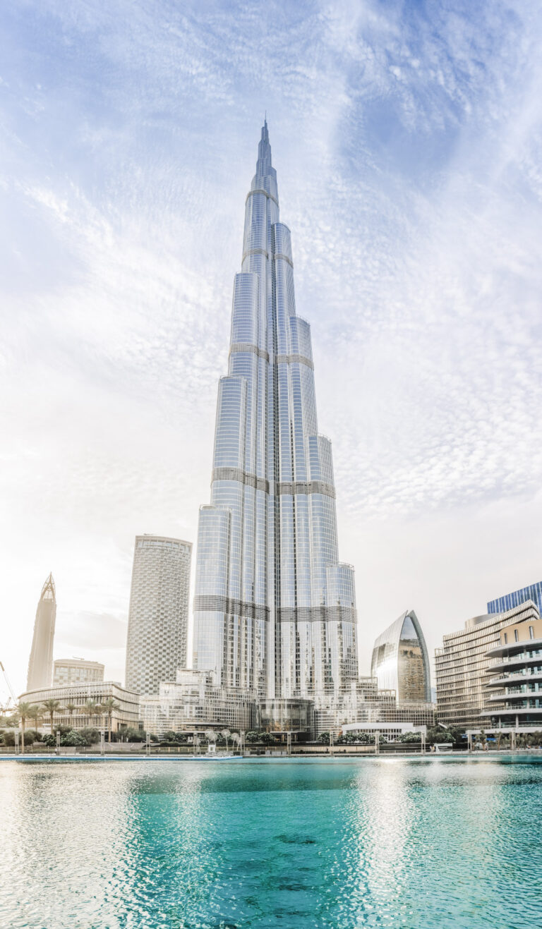 Crystal clear water surrounds the Burj Khalifa building. This article covers how-to make your business trip to Dubai feel like a mini vacation.