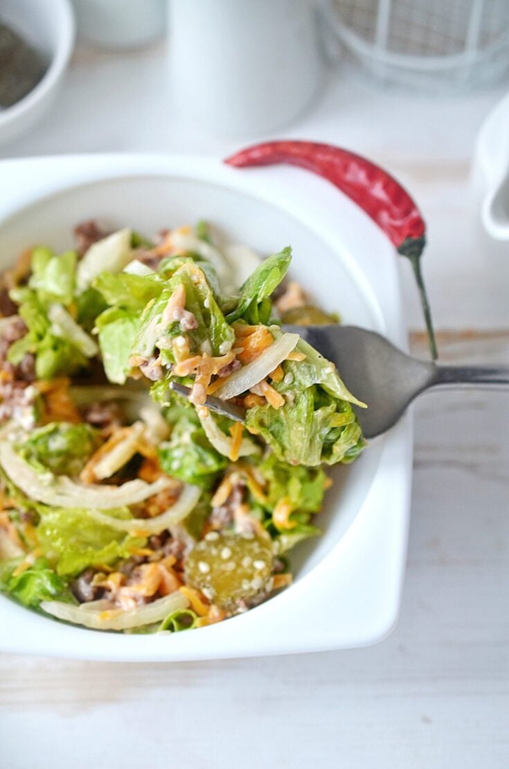 Big Mac in a Bowl recipe is shown in a white bowl with a fork.