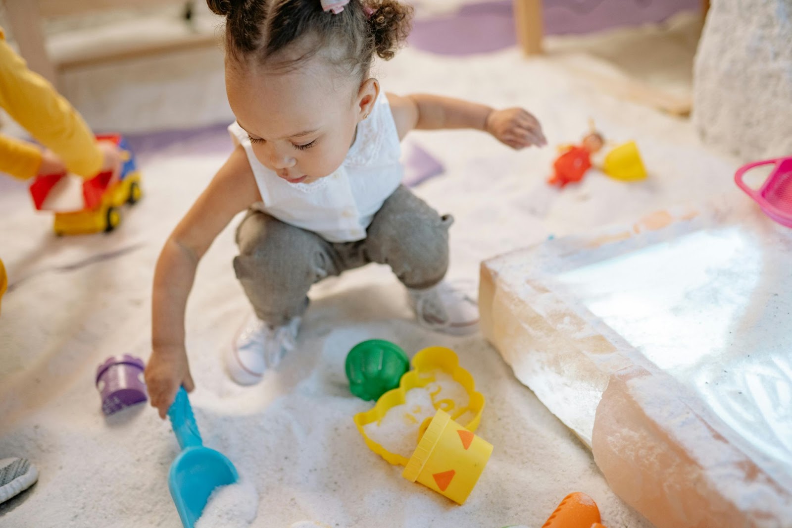 Child playing in an indoor playground. This article covers safe and stylish play areas for kids.