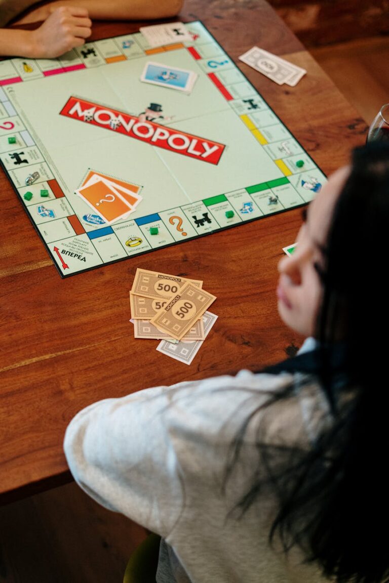 monopoly board game on brown wooden table top
