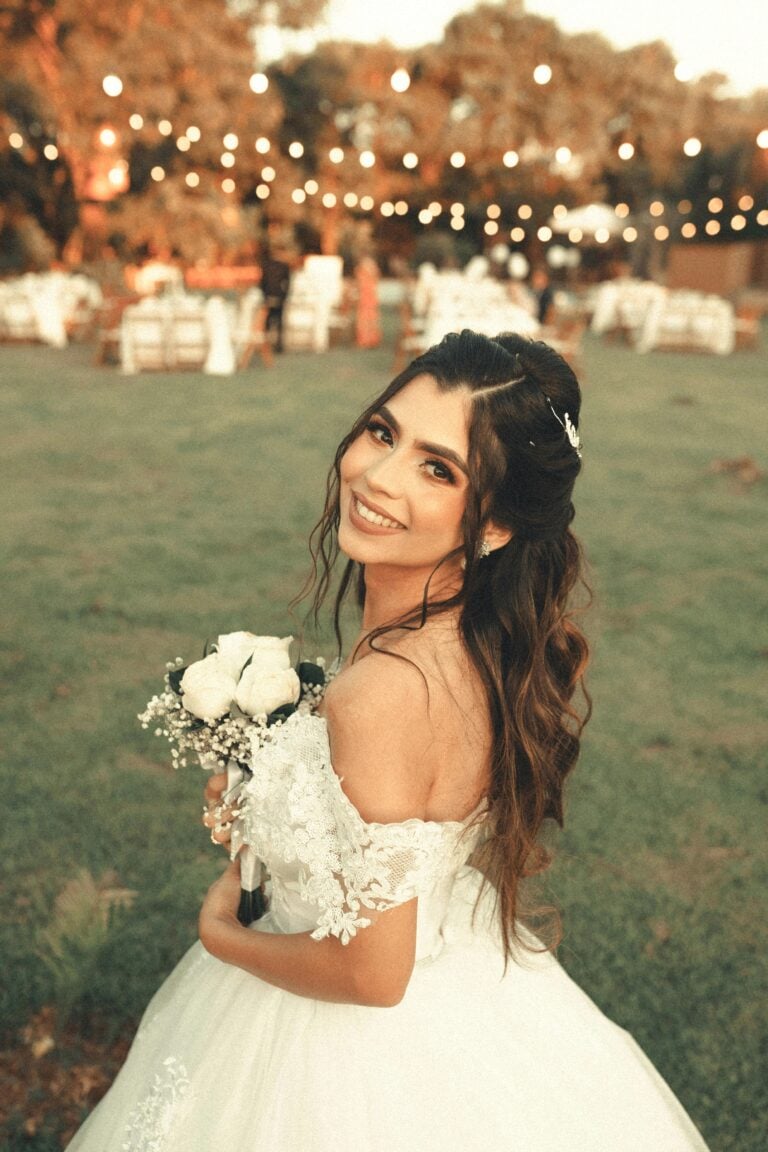 Close-up of a bride on her wedding day. This article covers the average wedding dress prices and what brides-to-be should expect to pay.