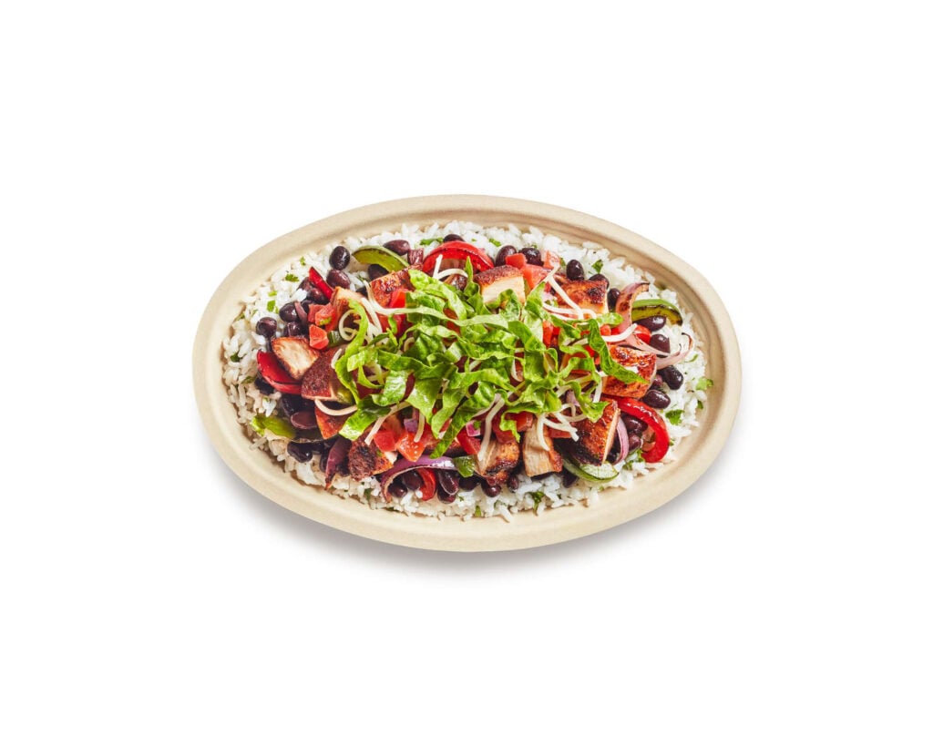 A chicken Chipotle bowl packed with adobo chicken and veggies. This article shares healthy Chipotle orders for on-the-go.