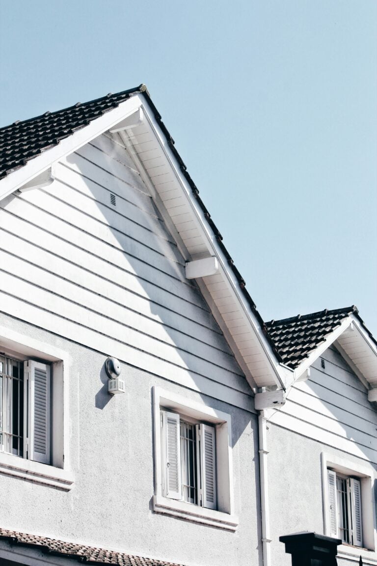 A home's roof is shown with a new roof installed. This article covers home improvement projects that deliver the best return on investment.