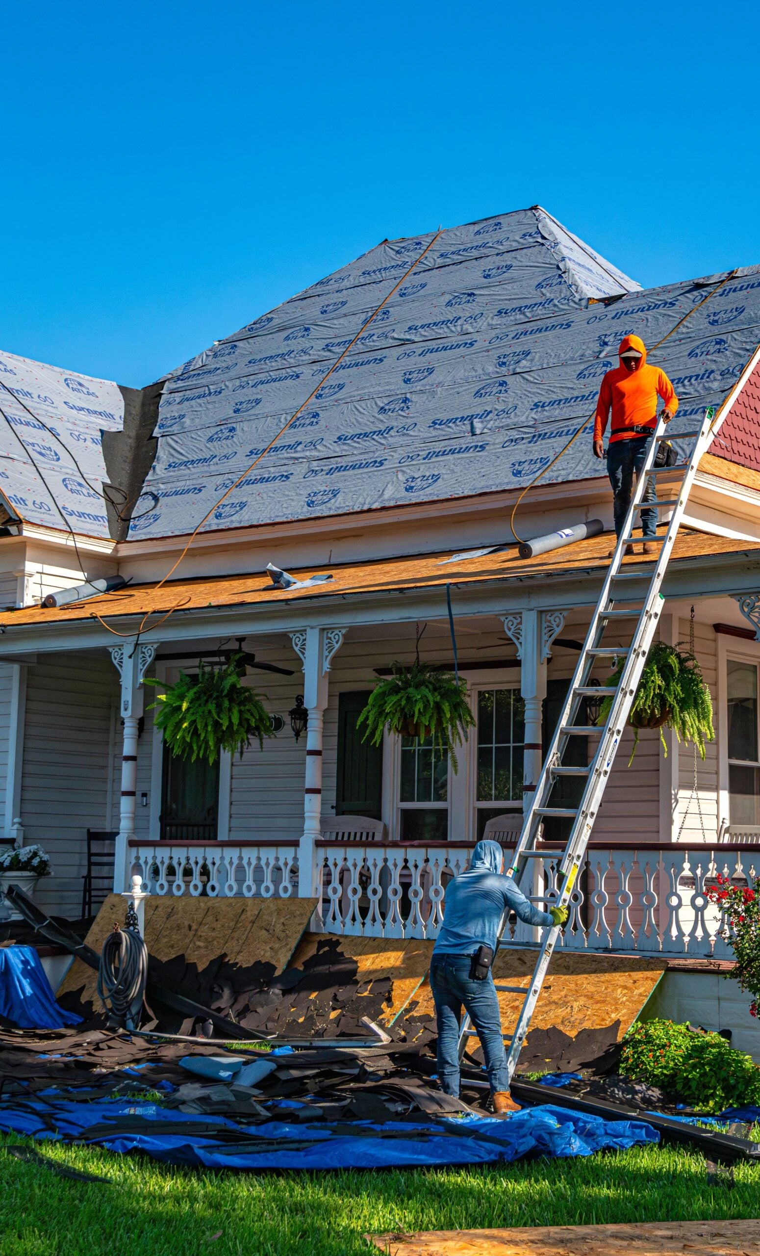 Roofers replace the roof of a historic home in Weatherford, Texas. This article shares how to plan a roof replacement without losing your mind.