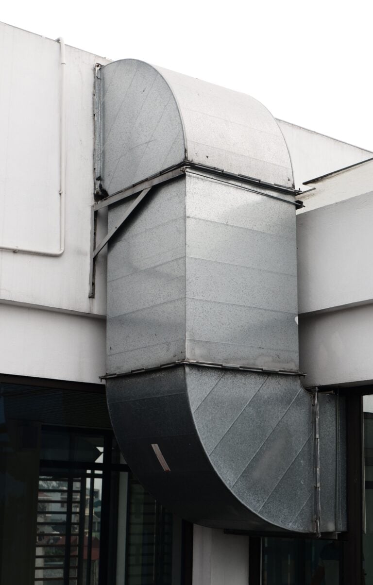 Close-up of a contemporary ventilation duct exterior in a city setting. This article shares a homeowner's guide to air duct cleaning in Austin.