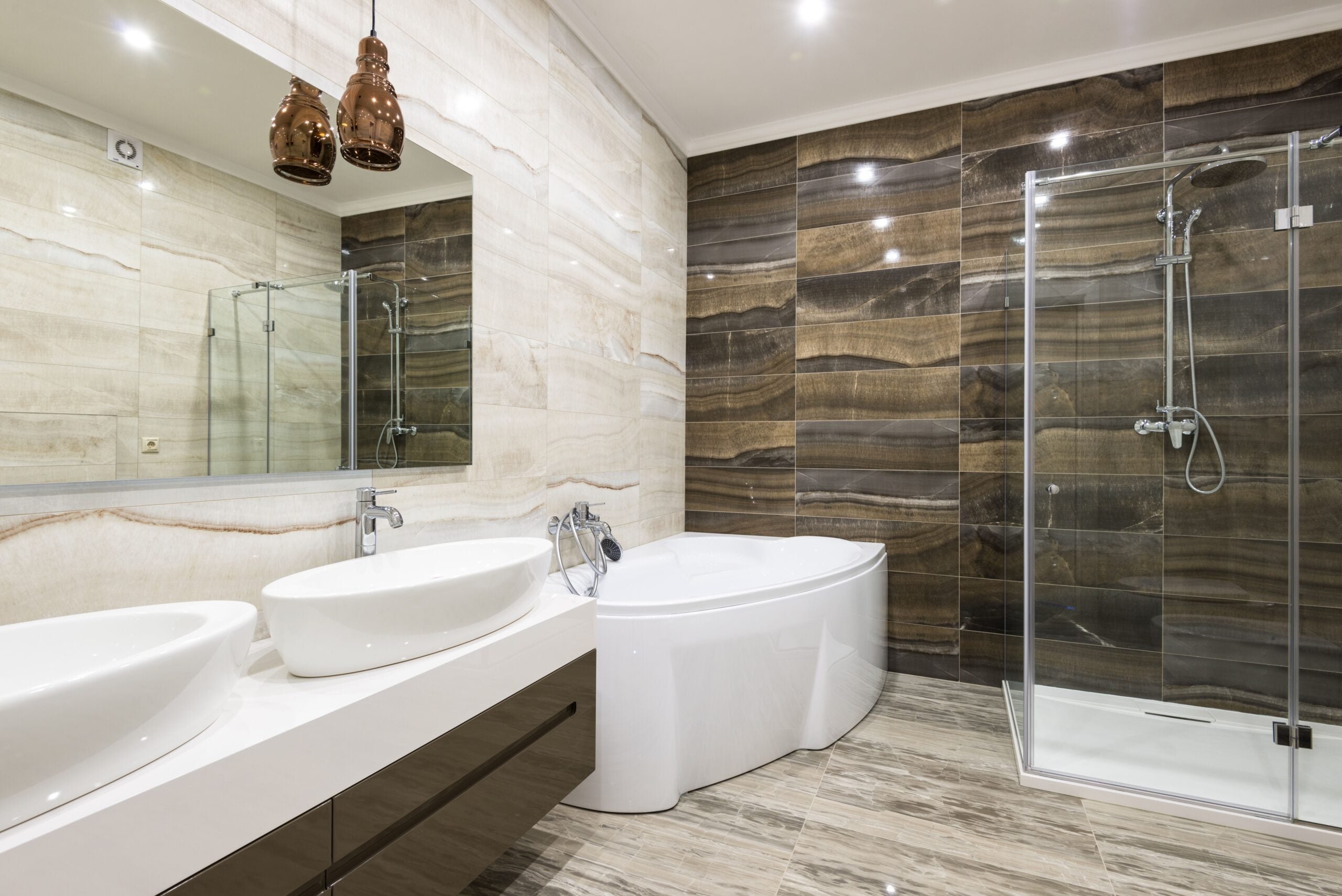 Contemporary bathroom design featuring sleek white fixtures and stylish tiles. This article shares a complete guide to walk-in tubs and safter bathroom design.
