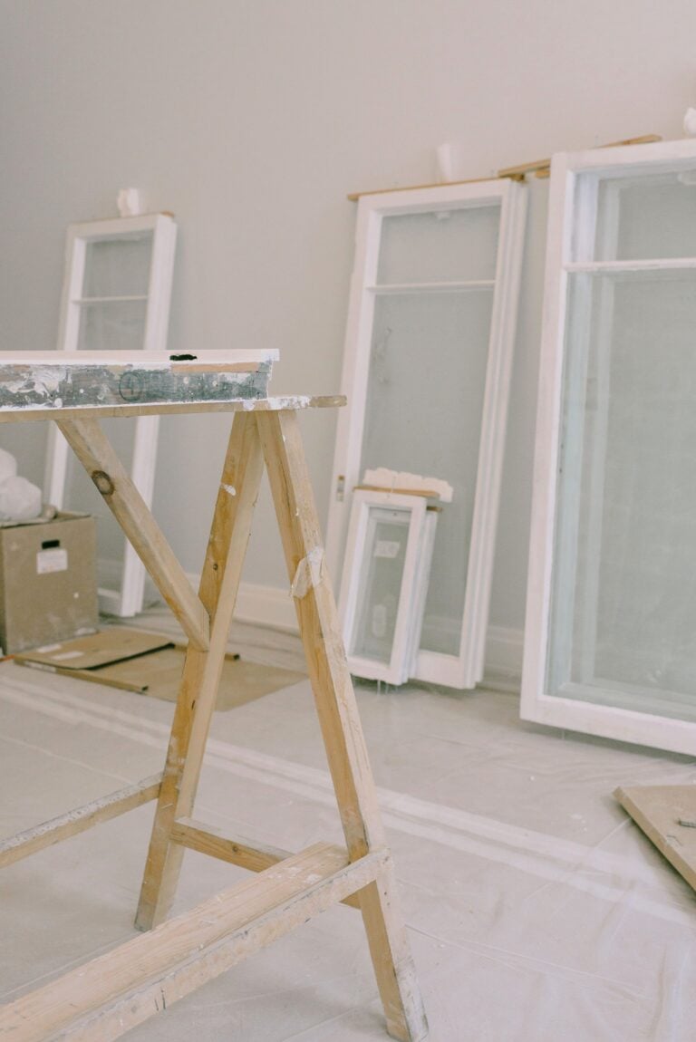 A room under renovation featuring windows and construction tools. This article shares how new windows can instantly improv your home's curb appeal.