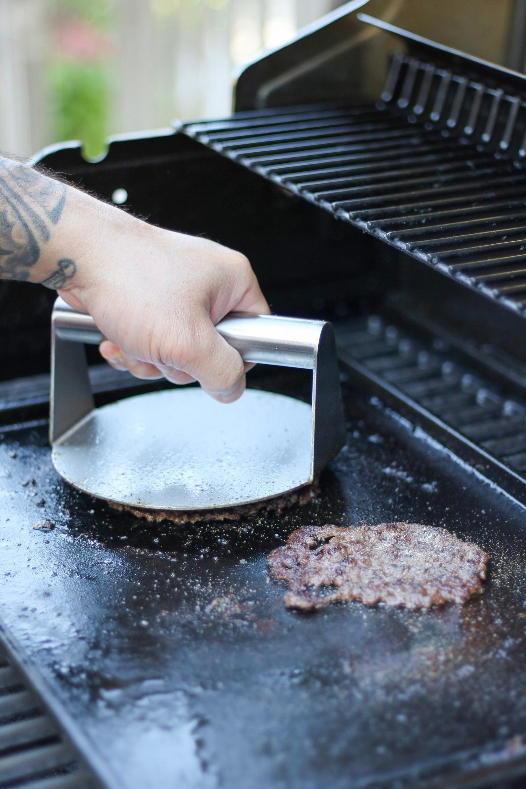 Another ultimate fall outdoor cooking and patio guide must, the Outset Stainless Steel Smash Burger Press.