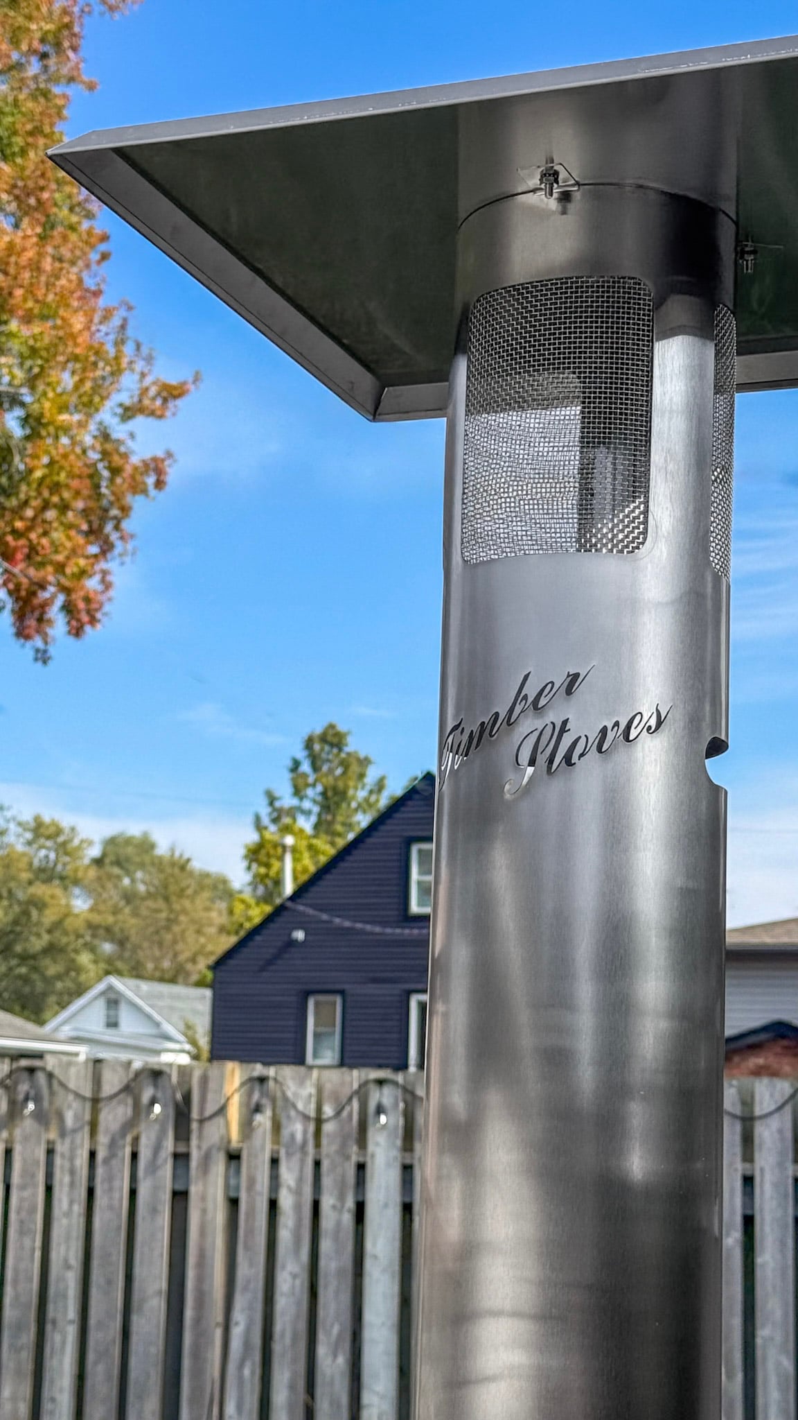 Close up of the Timber Stove before it is turned on. It is striking against the fall sky. This is an essential item in this ultimate fall outdoor and cooking and patio guide.